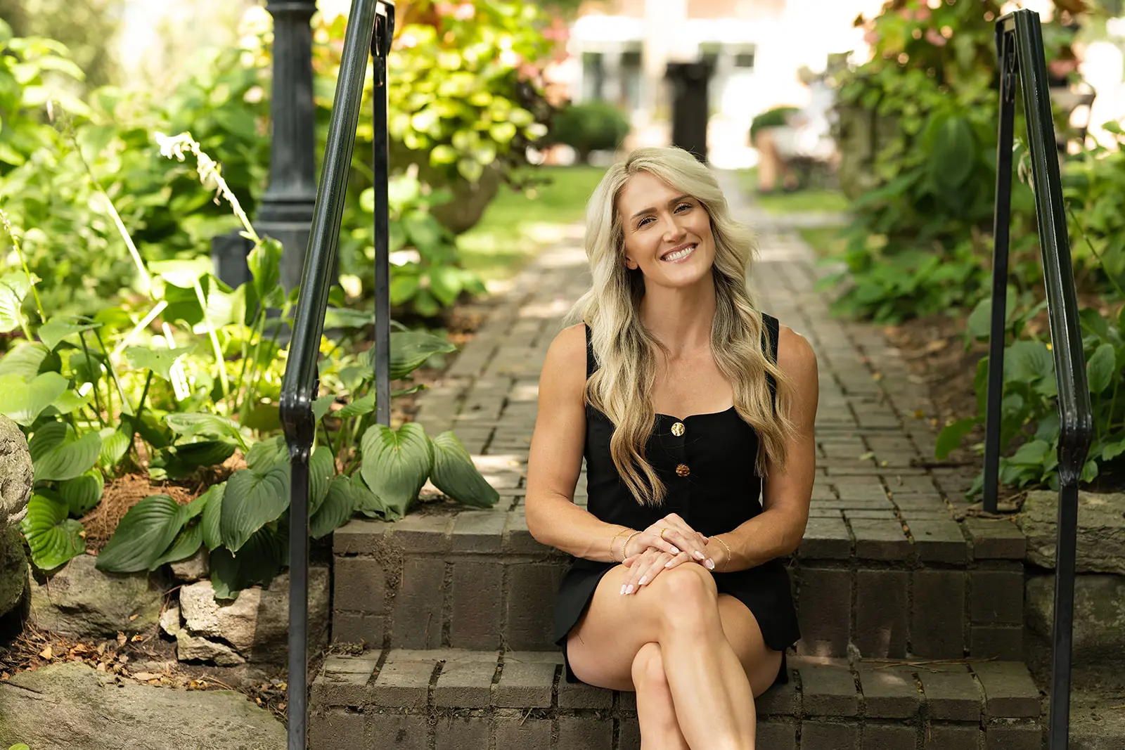 Lauren Wessel seated outdoors in a welcoming Cincinnati neighborhood setting
